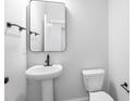 Small bathroom with pedestal sink and black fixtures at 364 Wappoo Trace Ln, Summerville, SC 29486