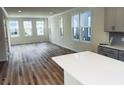 Spacious living room with hardwood floors and multiple windows at 768 Blueway Ave, Summerville, SC 29486