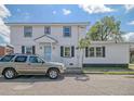 Newly renovated two-story home with a spacious front yard and updated exterior at 11 Reid St, Charleston, SC 29403