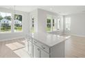 Kitchen island with white cabinets and quartz countertop at 335 Chapman Cir, Goose Creek, SC 29445