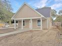 Newly built home with front porch and landscaping at 4566 Durant Ave, North Charleston, SC 29405
