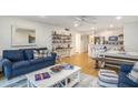 Open concept living and kitchen area with hardwood floors at 93 Mariners Cay Drive, Folly Beach, SC 29439