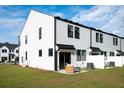 Private backyard with patio and modern townhouse exterior at 341 Bremerton Dr, Goose Creek, SC 29445