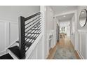 Modern entryway with black and white staircase and dog door at 345 Bremerton Dr, Goose Creek, SC 29445