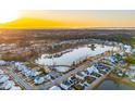 Aerial view of a lakefront community at sunset at 3885 Summerton St, Mount Pleasant, SC 29466