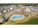Aerial view of community pool with lounge chairs and a covered pavilion at 3877 Summerton St, Mount Pleasant, SC 29466