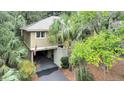 Aerial view of a house showcasing its location and driveway at 1111 Summerwind Lane, Seabrook Island, SC 29455