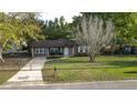 Brick ranch home with fenced yard and driveway at 101 Robin Ct, Summerville, SC 29485