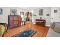 Spacious hallway with hardwood floors, antique furniture, and access to other rooms at 925 Center St, Mount Pleasant, SC 29464