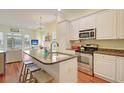 Spacious kitchen with granite countertops, stainless steel appliances, and an island at 204 Michigan Ave # D2, Folly Beach, SC 29439