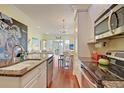 Bright kitchen features granite countertops, stainless steel appliances, and an open layout at 204 Michigan Ave # D2, Folly Beach, SC 29439
