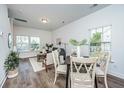 Open concept dining area with wood flooring and a view of the living room at 211 Cache Ct # 6, Charleston, SC 29414