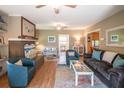 Bright living room with comfy seating and hardwood floors at 112 W Erie Ave # 106-B, Folly Beach, SC 29439