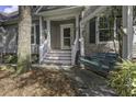 Charming front porch with a porch swing at 443 Lazy Hill Rd, Moncks Corner, SC 29461
