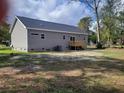 Rear view of gray house with deck at 168 Willow Ct, Walterboro, SC 29488