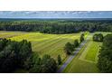 Aerial view of farmland with hay bales and a country road at 0 Tuten Road, Round O, SC 29474