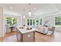 Open concept kitchen with island and hardwood floors at 426 Queenview Ln, Charleston, SC 29414