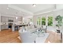 Open living space with hardwood floors and kitchen at 426 Queenview Ln, Charleston, SC 29414