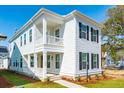 Two-story white house with black shutters, balcony, and landscaping at 127 Cantona Dr, Summerville, SC 29483