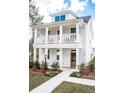Two-story white house with front porch and landscaping at 123 Cantona Dr, Summerville, SC 29483