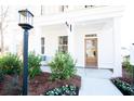 Inviting front porch with white columns and landscaping at 123 Cantona Dr, Summerville, SC 29483