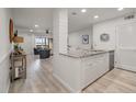 Modern white kitchen with granite countertops and stainless steel appliances at 1331 Pelican Watch Villas, Seabrook Island, SC 29455