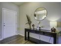 Bright entryway with console table, mirror, and lamp at 415 Snowy Plover Ln, Summerville, SC 29486