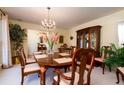 Formal dining room with wood table and chandelier at 1647 Sulgrave Rd, Charleston, SC 29414