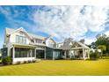 Spacious backyard with a large patio, covered porch and lush green lawn at 3811 Sawyers Island Dr, Mount Pleasant, SC 29466