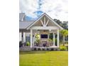 Covered patio with fireplace, seating area, and a built-in TV at 3811 Sawyers Island Dr, Mount Pleasant, SC 29466