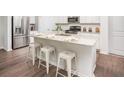 Kitchen island with granite countertop and seating for four at 233 Pine Crest View Dr, Summerville, SC 29486