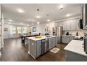 Modern kitchen with grey cabinets, quartz countertops, and an island at 139 Winding River Dr, Johns Island, SC 29455