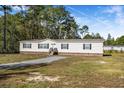 Single-story home with brick accents and a landscaped yard at 122 Rambo Dr, Summerville, SC 29483