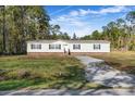 Single-story home with brick accents and a landscaped yard at 122 Rambo Dr, Summerville, SC 29483