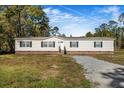 Single-story home with brick accents and a landscaped yard at 122 Rambo Dr, Summerville, SC 29483