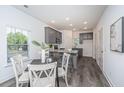 Modern kitchen with gray cabinets, granite countertops, and a breakfast bar at 104 Aplomb Aly # 16, Charleston, SC 29414