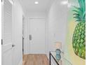 Light and airy entryway with a console table and large artwork at 1323 Pelican Watch Villas, Seabrook Island, SC 29455