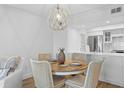 Charming dining area with round table and four chairs, kitchen view at 1323 Pelican Watch Villas, Seabrook Island, SC 29455