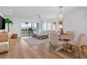 Bright living room with water views, light wood floors, and comfortable seating at 1323 Pelican Watch Villas, Seabrook Island, SC 29455