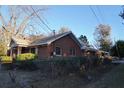 Side view of brick house with chain link fence at 150 M L King Blvd, Saint Stephen, SC 29479