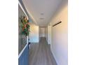 Bright entryway with grey vinyl flooring and coat rack at 6805 Sc-162, Hollywood, SC 29449