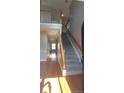 Bright entryway with hardwood floors and staircase leading to upper level at 1450 Coopers Hawk Dr, Hanahan, SC 29410