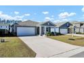 Newly built home with a gray exterior and two-car garage at 407 Hampstead Ct, Summerville, SC 29486