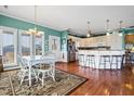 Bright kitchen with island, stainless steel appliances, and hardwood floors at 202 Mary St, Edisto Island, SC 29438