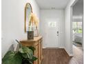 Bright and airy entryway with wood-look floors, and decorative accents at 2215 Macallan Blvd, Ravenel, SC 29470