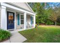 Charming front porch with rocking chairs and a fall wreath at 1814 Chauncys Ct, Mount Pleasant, SC 29466