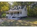 House exterior showcasing a front porch and landscaping at 3260 Cohen Hill Rd, Johns Island, SC 29455