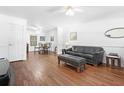 Living room features hardwood floors and a leather couch at 3260 Cohen Hill Rd, Johns Island, SC 29455