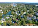 Aerial view of home and neighborhood with a pond at 3400 Henrietta Hartford Rd, Mount Pleasant, SC 29466