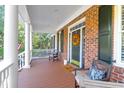Front porch with white columns and comfortable seating at 3400 Henrietta Hartford Rd, Mount Pleasant, SC 29466